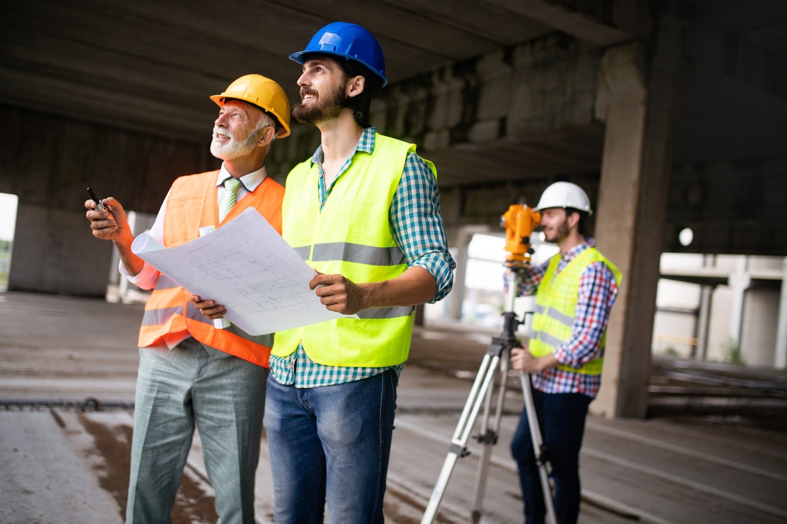 Construction engineer with foreman worker checking construction site