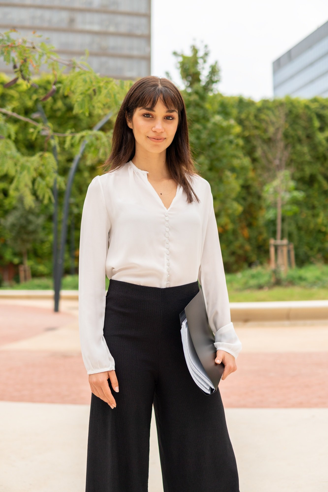 Female manager standing on street