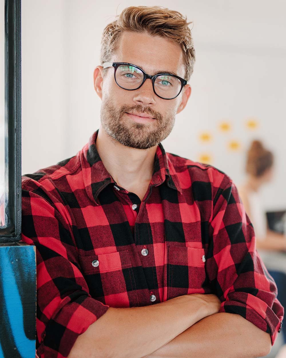 portrait-of-positive-businessman-in-office-PNPWR2X.jpeg
